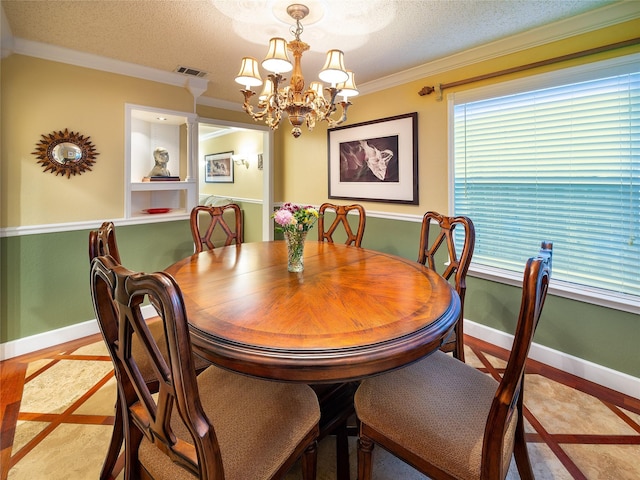 dining space with ornamental molding, a chandelier, baseboards, and a textured ceiling
