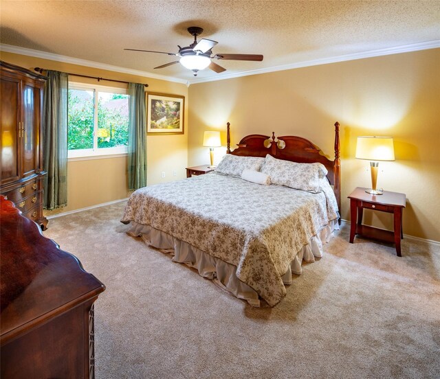 bedroom featuring a textured ceiling, carpet, ornamental molding, baseboards, and a ceiling fan