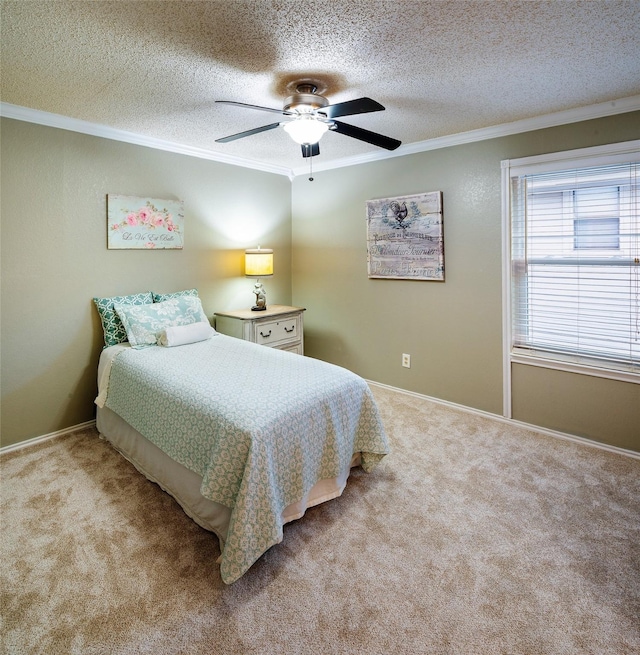 bedroom featuring crown molding, a textured ceiling, light carpet, a ceiling fan, and baseboards