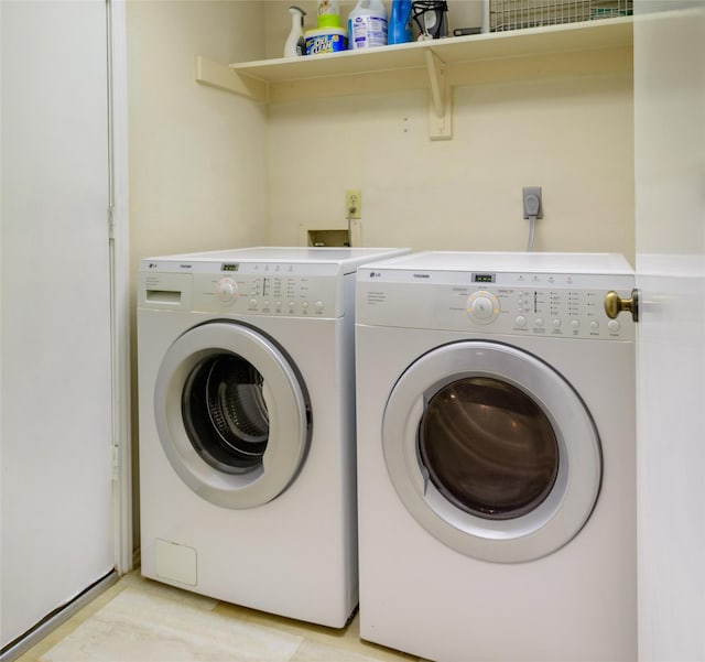 clothes washing area with washer and dryer