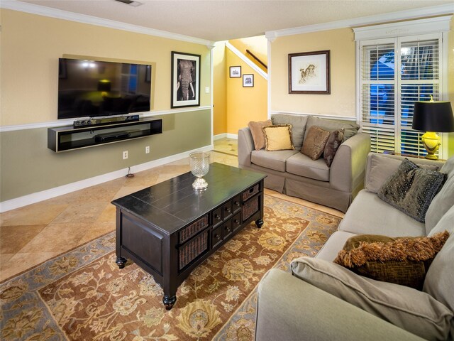 tiled living area with crown molding and baseboards