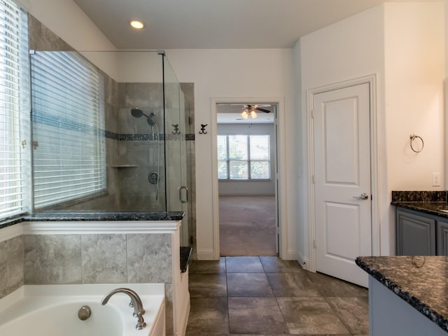 928 Freesia Dr, Little Elm, TX 75068 - full bathroom with a stall shower, vanity, a garden tub, ceiling fan, and tile patterned floors