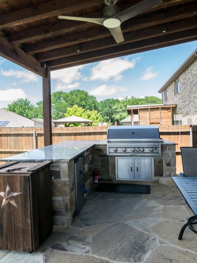 928 Freesia Dr, Little Elm, TX 75068 - view of patio / terrace featuring exterior kitchen, a fenced backyard, grilling area, and ceiling fan