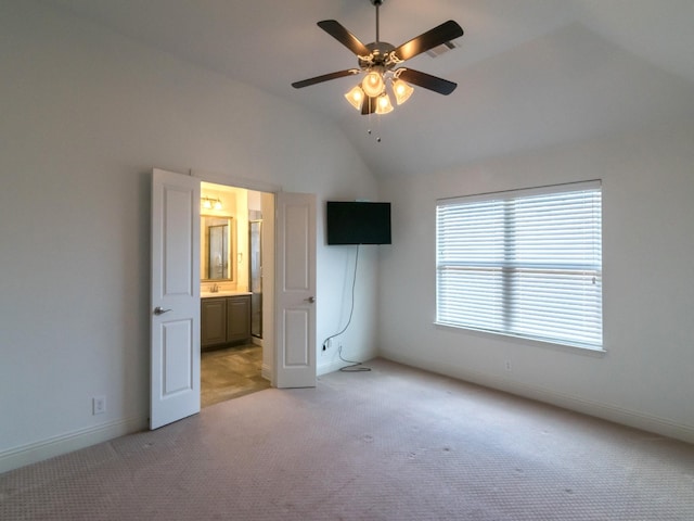 928 Freesia Dr, Little Elm, TX 75068 - unfurnished bedroom featuring light carpet, lofted ceiling, baseboards, ensuite bath, and a ceiling fan