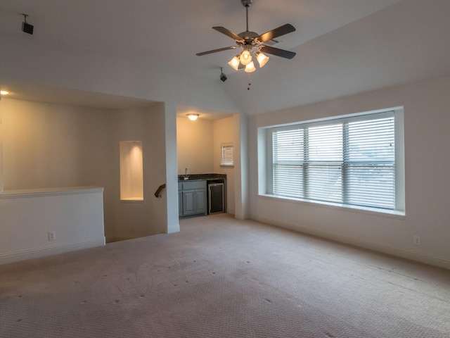 928 Freesia Dr, Little Elm, TX 75068 - unfurnished living room with light colored carpet, lofted ceiling, ceiling fan, and baseboards