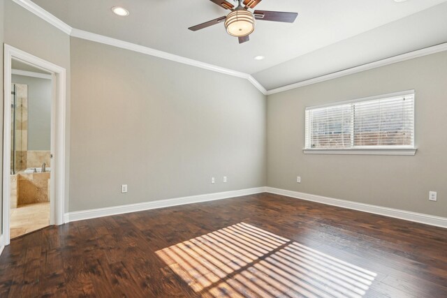 spare room featuring crown molding, ceiling fan, vaulted ceiling, baseboards, and wood finished floors