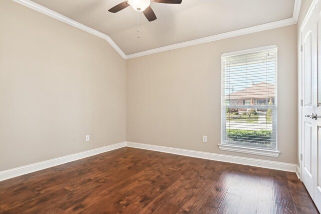 spare room featuring healthy amount of natural light, dark wood finished floors, ceiling fan, crown molding, and baseboards