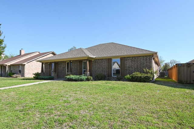 ranch-style house featuring brick siding and central AC