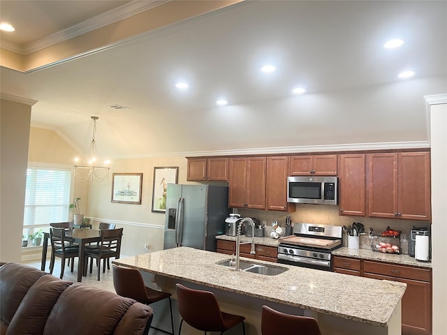 9812 Shadybrooke Dr, Shreveport, LA 71115 - kitchen featuring appliances with stainless steel finishes, a sink, a breakfast bar area, a chandelier, and a center island with sink