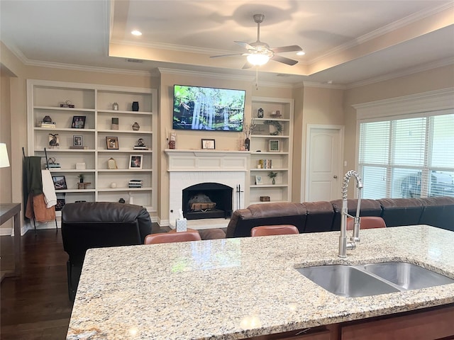 9812 Shadybrooke Dr, Shreveport, LA 71115 - kitchen featuring a sink, open floor plan, a tray ceiling, and crown molding