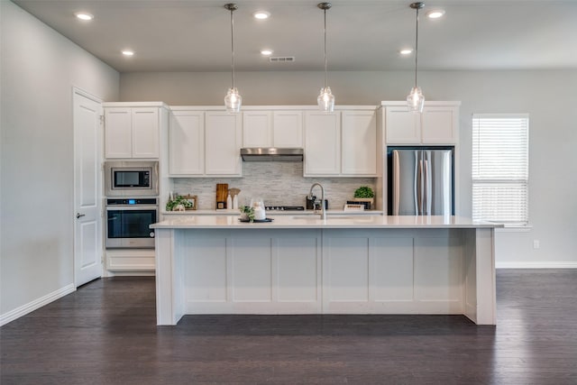 3001 Renmuir Dr, Prosper, TX 75078 - kitchen featuring stainless steel appliances, baseboards, decorative backsplash, light countertops, and under cabinet range hood