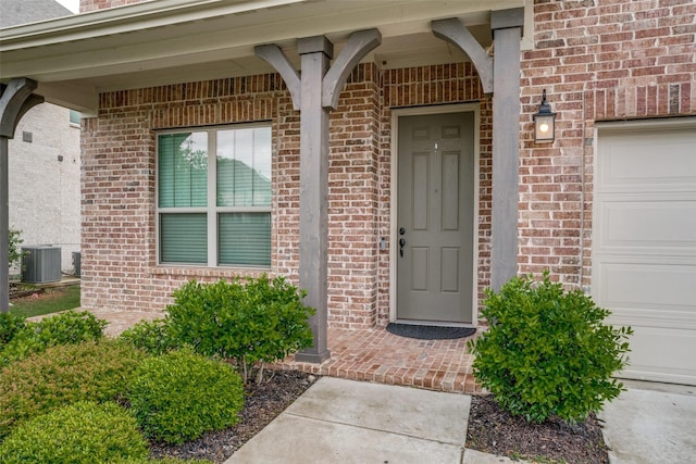 3001 Renmuir Dr, Prosper, TX 75078 - entrance to property featuring central AC, brick siding, and a garage
