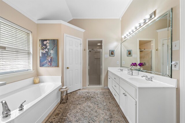 full bath with a shower stall, crown molding, a garden tub, and double vanity