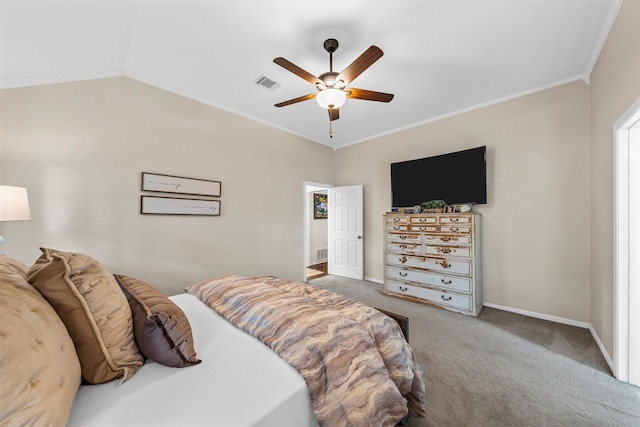 carpeted bedroom with crown molding, baseboards, ceiling fan, and vaulted ceiling