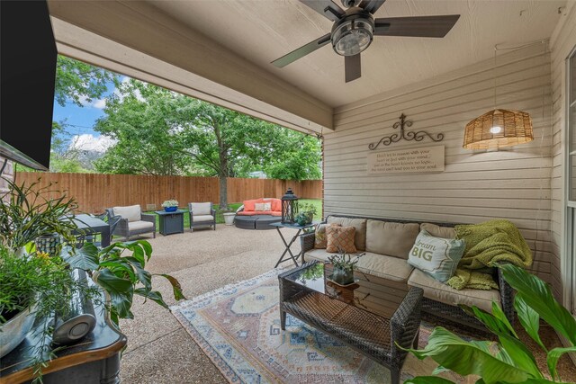 view of patio / terrace featuring an outdoor living space, a fenced backyard, and ceiling fan