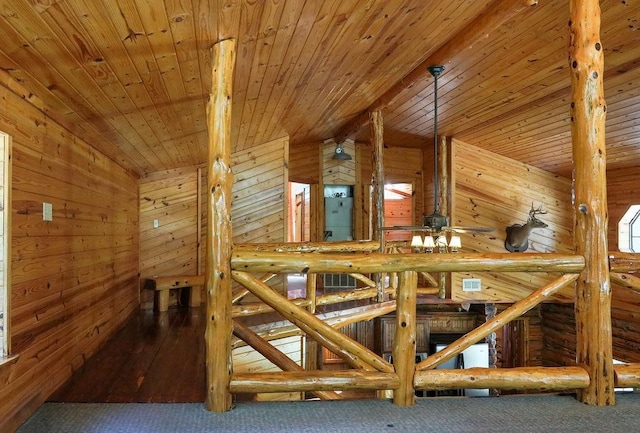 interior space featuring wooden ceiling, wood walls, lofted ceiling, and carpet flooring