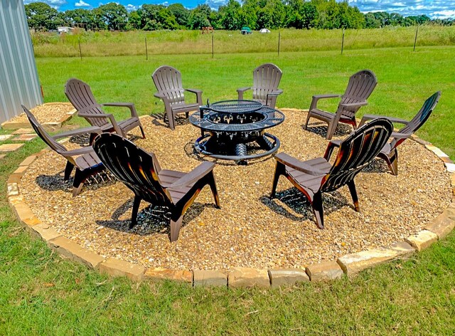6861 County Road 4710, Larue, TX 75770 - view of grassy yard with a fire pit and view of scattered trees