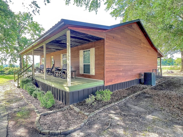 6861 County Road 4710, Larue, TX 75770 - view of side of property featuring central AC and covered porch