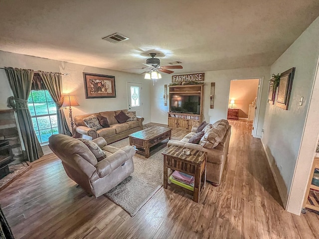 6861 County Road 4710, Larue, TX 75770 - living area featuring wood finished floors, a ceiling fan, and baseboards