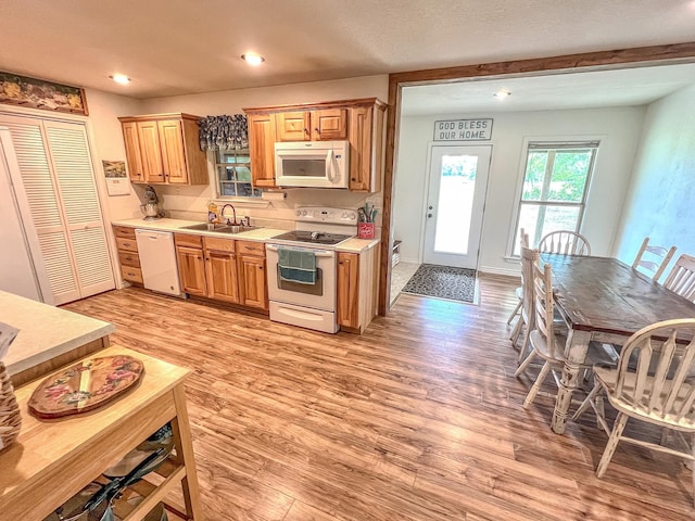 6861 County Road 4710, Larue, TX 75770 - kitchen with white appliances, light countertops, light wood finished floors, a sink, and recessed lighting
