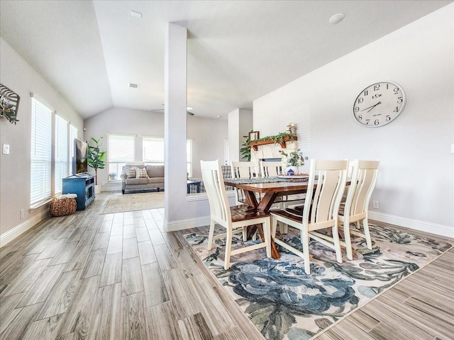 1152 Snowy Owl Dr, Alvarado, TX 76009 - dining area featuring wood finished floors, lofted ceiling, and baseboards