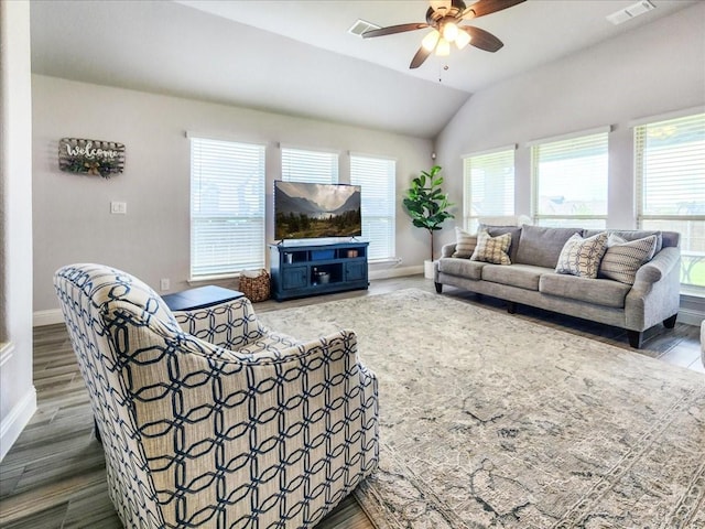 1152 Snowy Owl Dr, Alvarado, TX 76009 - living room with plenty of natural light, baseboards, wood finished floors, ceiling fan, and vaulted ceiling