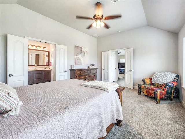 1152 Snowy Owl Dr, Alvarado, TX 76009 - carpeted bedroom featuring lofted ceiling, connected bathroom, a ceiling fan, and baseboards