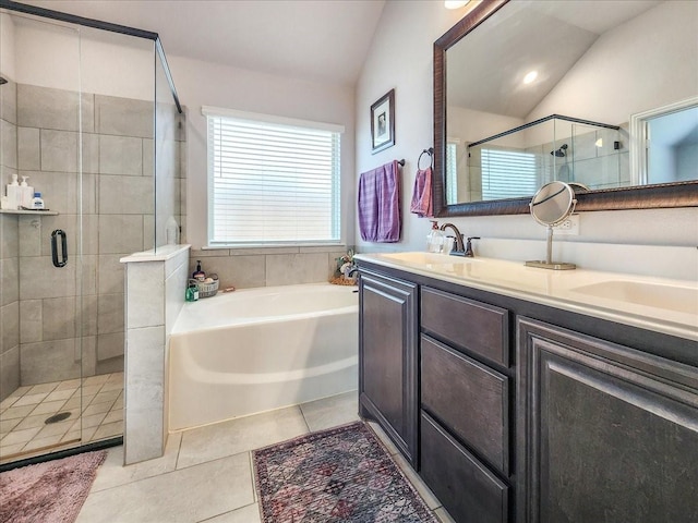 1152 Snowy Owl Dr, Alvarado, TX 76009 - bathroom with vaulted ceiling, a stall shower, a garden tub, tile patterned floors, and double vanity