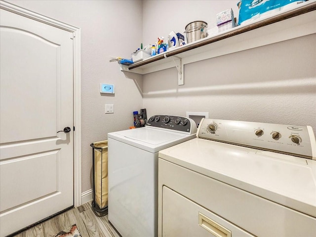 1152 Snowy Owl Dr, Alvarado, TX 76009 - laundry area with independent washer and dryer, light wood-style flooring, and baseboards