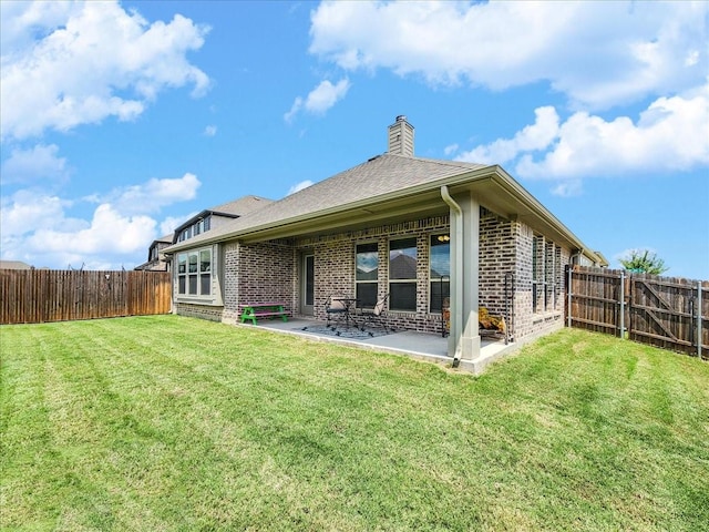 1152 Snowy Owl Dr, Alvarado, TX 76009 - back of property featuring brick siding, a patio, and a chimney