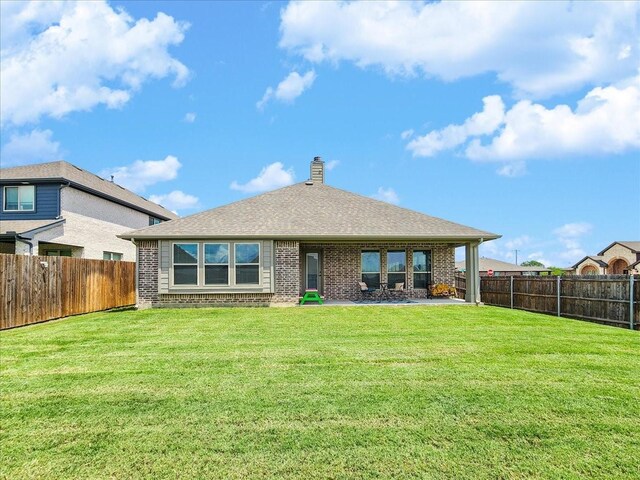 1152 Snowy Owl Dr, Alvarado, TX 76009 - back of property featuring brick siding, a chimney, and roof with shingles