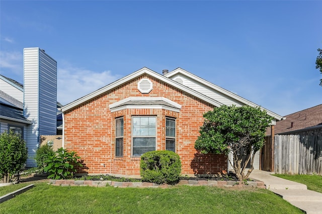 view of front of home with brick siding