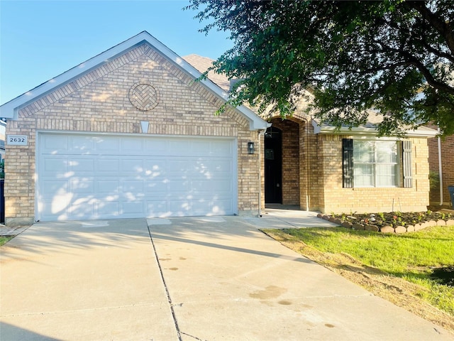 2632 Lake Ridge Dr, Little Elm, TX 75068 - view of front facade with driveway, an attached garage, and brick siding