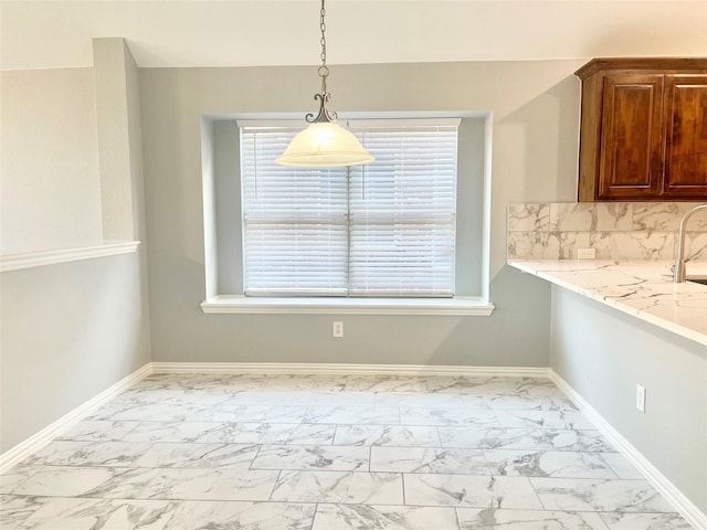 2632 Lake Ridge Dr, Little Elm, TX 75068 - unfurnished dining area with marble look tiles and baseboards