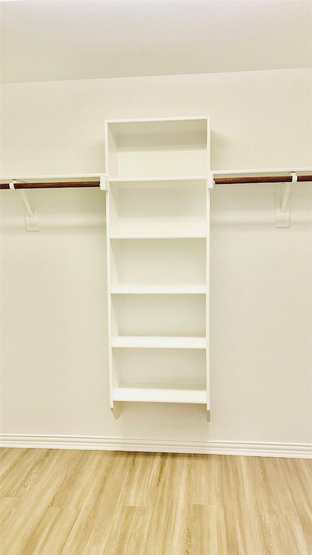 2632 Lake Ridge Dr, Little Elm, TX 75068 - walk in closet with wood finished floors