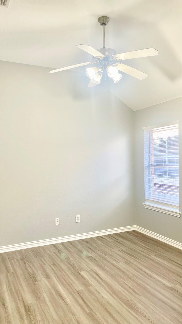 2632 Lake Ridge Dr, Little Elm, TX 75068 - spare room with light wood-style flooring, a ceiling fan, baseboards, and vaulted ceiling