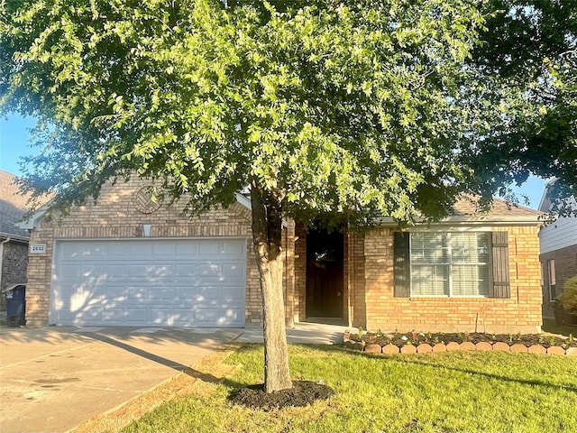 2632 Lake Ridge Dr, Little Elm, TX 75068 - obstructed view of property with brick siding, concrete driveway, an attached garage, and a front lawn