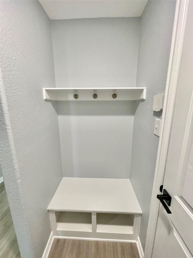 2632 Lake Ridge Dr, Little Elm, TX 75068 - mudroom featuring wood finished floors and a textured wall