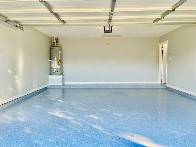 2632 Lake Ridge Dr, Little Elm, TX 75068 - garage with gas water heater, baseboards, and a garage door opener
