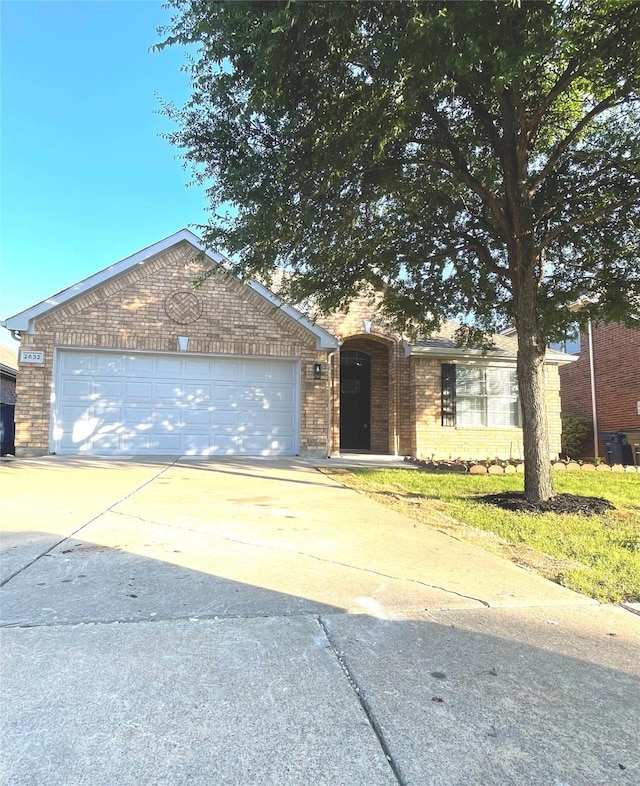 2632 Lake Ridge Dr, Little Elm, TX 75068 - view of front facade with brick siding, driveway, and an attached garage
