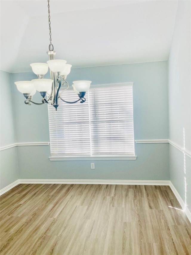 2632 Lake Ridge Dr, Little Elm, TX 75068 - unfurnished dining area featuring a chandelier, wood finished floors, baseboards, and plenty of natural light