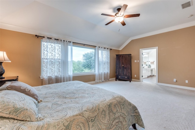 bedroom featuring vaulted ceiling, ornamental molding, baseboards, light carpet, and connected bathroom