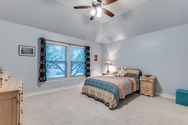 bedroom with carpet floors, baseboards, a ceiling fan, and vaulted ceiling