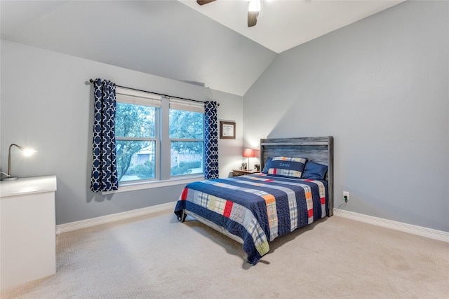 bedroom with carpet floors, baseboards, lofted ceiling, and a ceiling fan