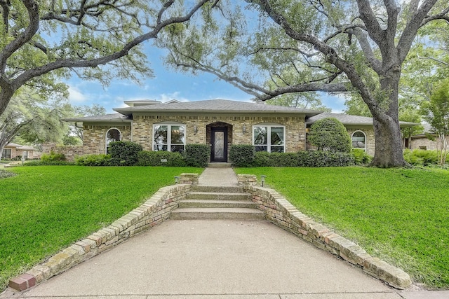 4020 Kerr Ct, Farmers Branch, TX 75244 - view of front of home featuring a front lawn, a shingled roof, and brick siding