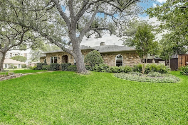 4020 Kerr Ct, Farmers Branch, TX 75244 - view of front facade with brick siding, a front yard, a shingled roof, and a chimney