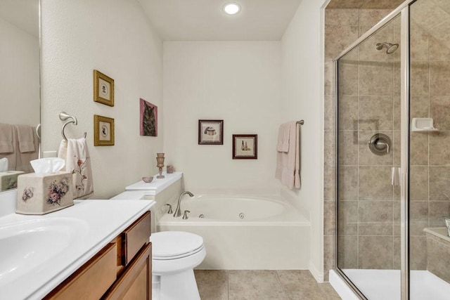 bathroom with a shower stall, tile patterned flooring, a garden tub, and vanity
