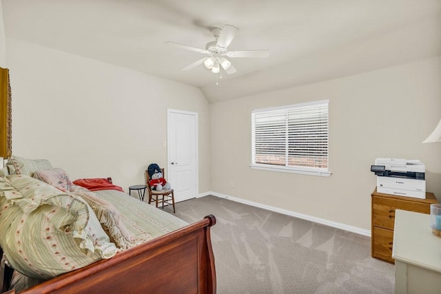 bedroom featuring carpet, baseboards, vaulted ceiling, and ceiling fan