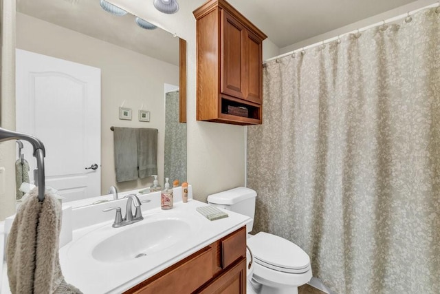 full bath featuring toilet and vanity
