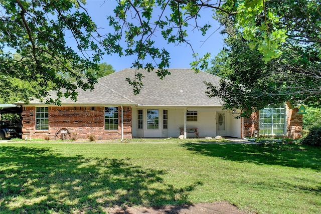118 Brangus Ct, Paradise, TX 76073 - rear view of property featuring brick siding, roof with shingles, and a lawn
